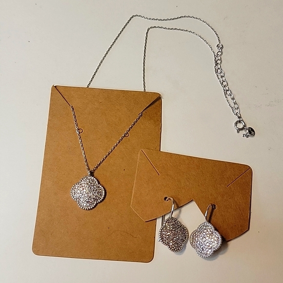 Pave diamond necklace and earrings set in sterling silver. Chain is 18